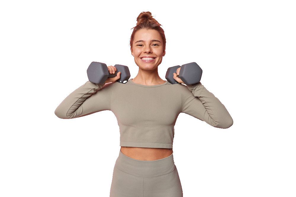 horizontal-shot-satisfied-motivated-sportswoman-has-regular-training-raises-arms-with-dumbbells-does-exercises-muscles-dressed-sportswear-smiles-toothily-isolated-pink-wall-sport-concept
